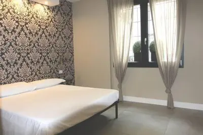 Letto o letti in una camera di Casa Odino Bilocale