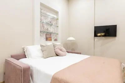 Letto o letti in una camera di Pallottole Duomo Apartments