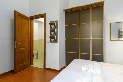 Letto o letti in una camera di Pallottole Duomo Apartments