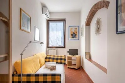 Area soggiorno di Borgo la Croce 1830 Heritage Apartment