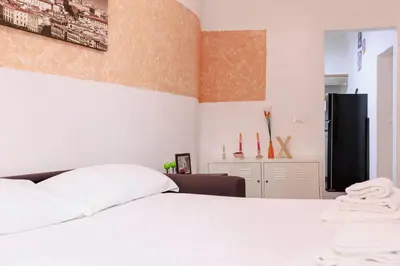 Letto o letti in una camera di Cozy House in Pepi Street