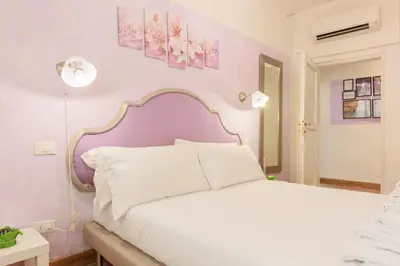 Letto o letti in una camera di Cozy House in Pepi Street