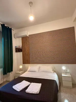 Letto o letti in una camera di Villa Caterina