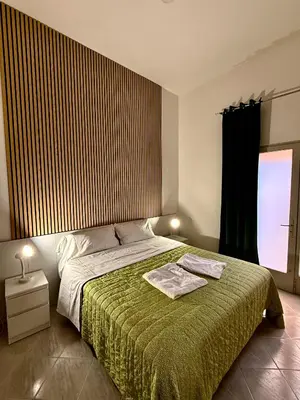 Letto o letti in una camera di Villa Caterina