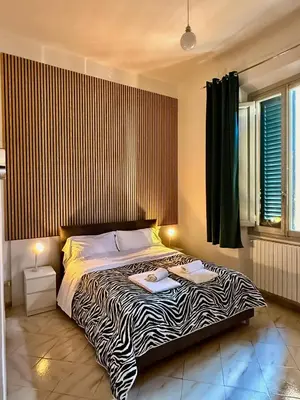 Letto o letti in una camera di Villa Caterina