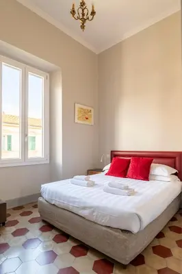Letto o letti in una camera di Camere con bagno privato in Villa con giardino