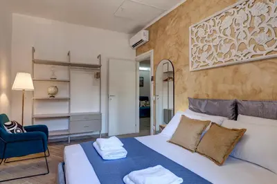Letto o letti in una camera di Barnaba Apartment by Mamo Florence