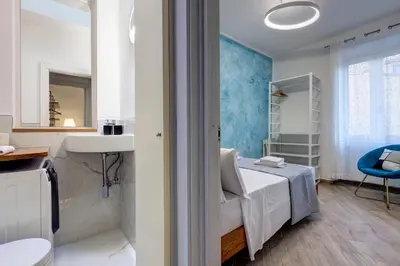 Letto o letti in una camera di Barnaba Apartment by Mamo Florence