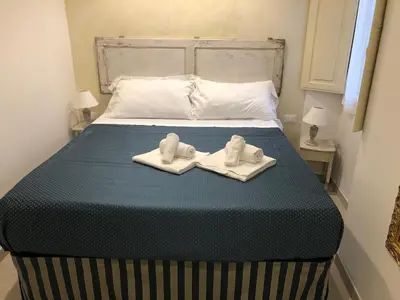 Letto o letti in una camera di SUITE PICCOLO PRINCIPE, Ognissanti square