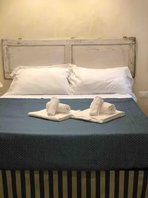 Letto o letti in una camera di SUITE PICCOLO PRINCIPE, Ognissanti square