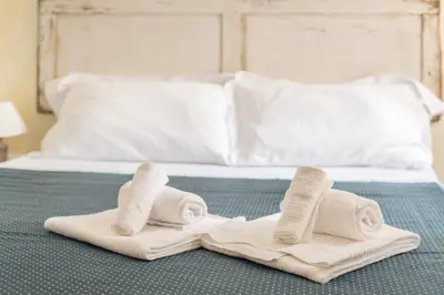 Letto o letti in una camera di SUITE PICCOLO PRINCIPE, Ognissanti square
