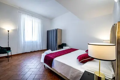 Letto o letti in una camera di YD Florentine Charm & Comfort