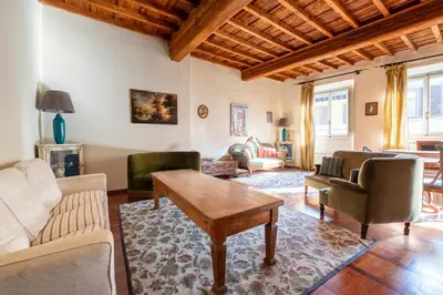 Area soggiorno di Camere con bagno privato in APT condiviso Palazzo Pitti