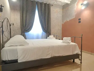 Letto o letti in una camera di BNB Frescoes Rooms San Frediano