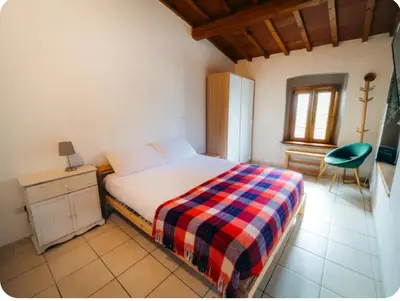 Letto o letti in una camera di Bilocale Artimino campagna toscana