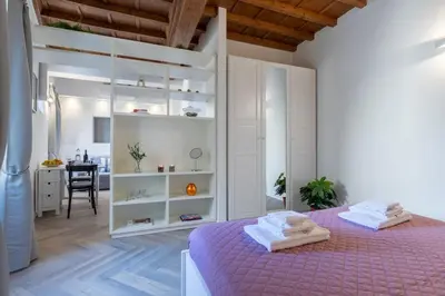 Letto o letti in una camera di Bijoux Suite near Boboli Gardens