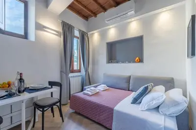 Letto o letti in una camera di Bijoux Suite near Boboli Gardens