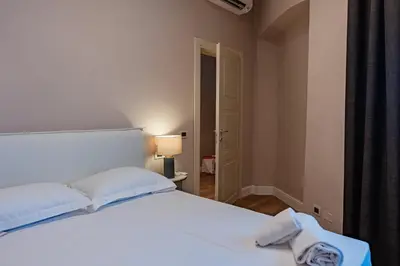 Letto o letti in una camera di Florence Dome Rooms