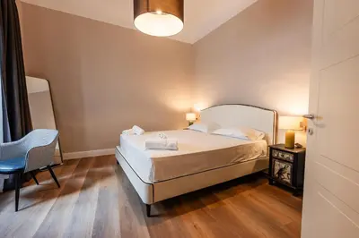 Letto o letti in una camera di Florence Dome Rooms