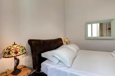 Letto o letti in una camera di Nerone Apartment by Mamo Florence