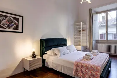 Letto o letti in una camera di Nerone Apartment by Mamo Florence