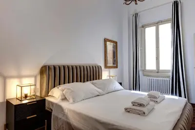 Letto o letti in una camera di Nerone Apartment by Mamo Florence