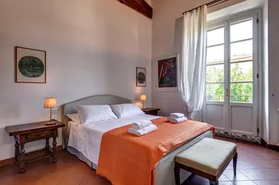 Letto o letti in una camera di Farinata Apartment by Mamo Florence