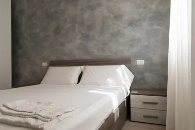 Letto o letti in una camera di Tramvia Home con Parcheggio privato