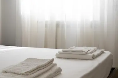 Letto o letti in una camera di Tramvia Home con Parcheggio privato