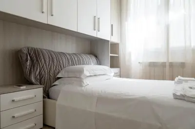 Letto o letti in una camera di Tramvia Home con Parcheggio privato