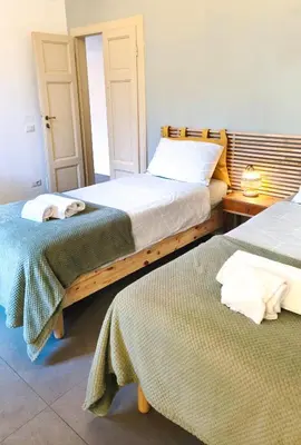 Letto o letti in una camera di Nonna Ines