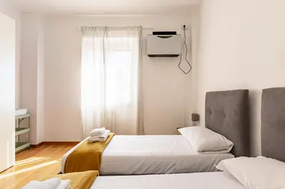 Letto o letti in una camera di GuestHost - Ponte Vecchio Charming Apartments