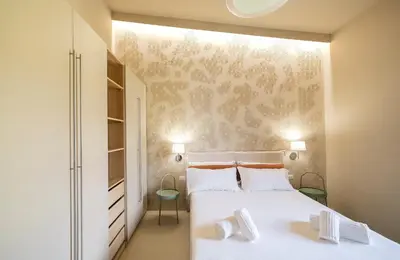 Letto o letti in una camera di Sand Living