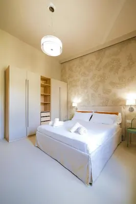 Letto o letti in una camera di Sand Living