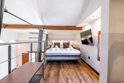 Letto o letti in una camera di Grande Apt 10 ospiti, Wi-Fi, Centro, Promo Inverno
