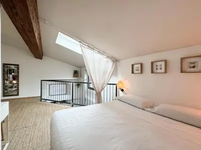 Letto o letti in una camera di Studio Janna - Palazzo Gaddi Heritage in Florence's Historic Heart