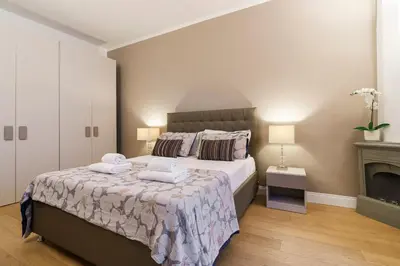 Letto o letti in una camera di Il Giglio Nascosto By San Firenze Collection