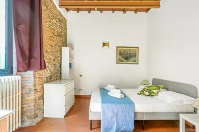 Letto o letti in una camera di GuestHost - Florence Nest Steps from Cascine Park