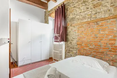 Letto o letti in una camera di GuestHost - Florence Nest Steps from Cascine Park