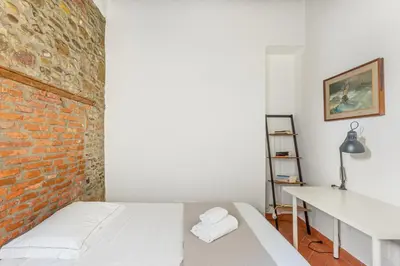 Letto o letti in una camera di GuestHost - Florence Nest Steps from Cascine Park