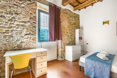 Letto o letti in una camera di GuestHost - Florence Nest Steps from Cascine Park