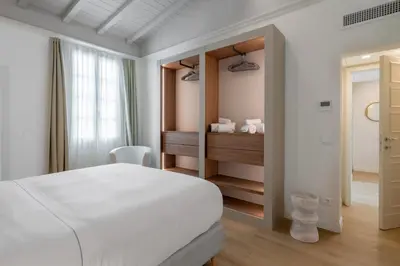 Letto o letti in una camera di Elegant Apartments Near The Duomo