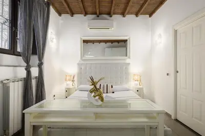 Letto o letti in una camera di Rustic Florentine Dimora