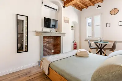 Letto o letti in una camera di Santa Croce Tiny Suite - Centro di Firenze - 9' Duomo
