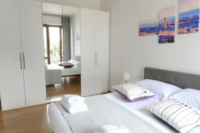 Letto o letti in una camera di Belfiore Apartments near the tramway