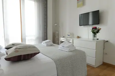 Letto o letti in una camera di Belfiore Apartments near the tramway