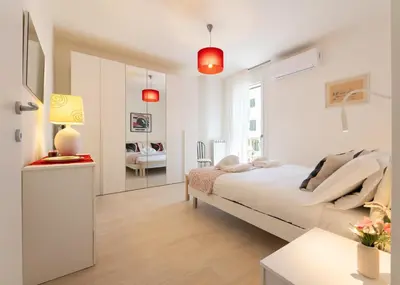 Letto o letti in una camera di Florence Charming Apartments - Conventino Modern - One-bedroom Flat with Living Area and Garage near Boboli