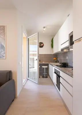 Cucina o angolo cottura di Florence Charming Apartments - Conventino Modern - One-bedroom Flat with Living Area and Garage near Boboli