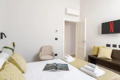 Letto o letti in una camera di Domus Mea Suite