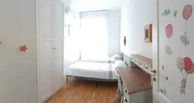 Letto o letti in una camera di Casa Camilla, bright terraced familyhome, AC